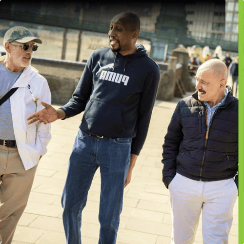 Three men walking and talking